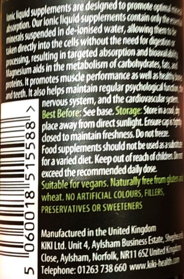 Close-up of the back of a dietary supplement bottle showing white text on a dark background with usage instructions, barcode, and manufacturer details.