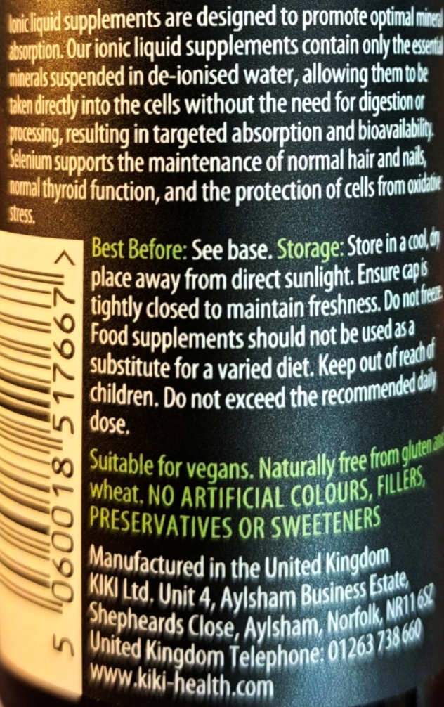 Close-up of a supplement bottle label with a barcode on the left and black background with green and white text detailing storage, suitability, and manufacturer information.