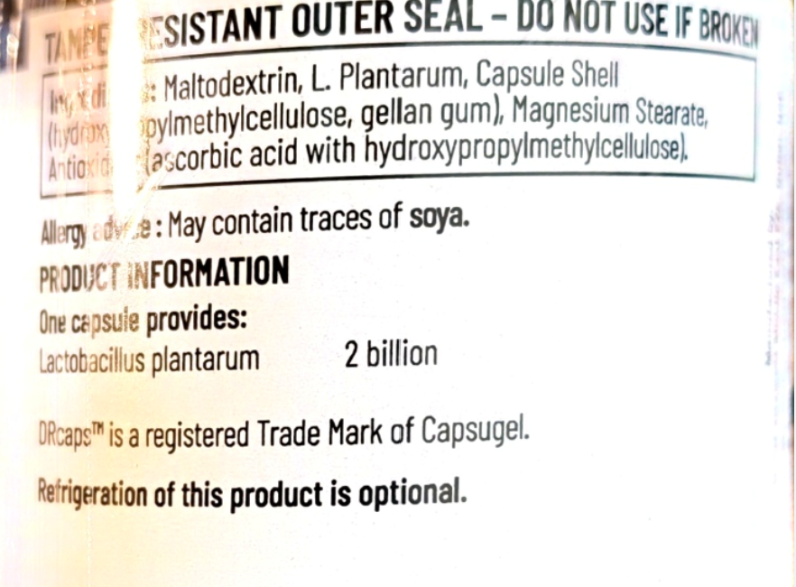 Close-up of a product information label showing text about Capsugel's resistant outer seal ingredients and product information, including 'One capsule provides: Lactobacillus plantarum 2 billion'.