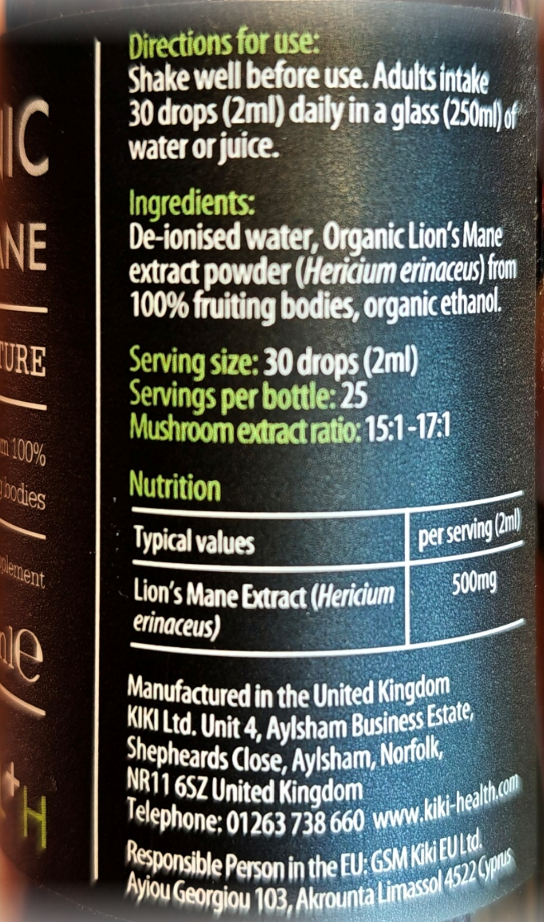 Close-up of a supplement bottle label showing usage directions, ingredients, serving size, and nutrition facts in white text on a dark blue and black background.