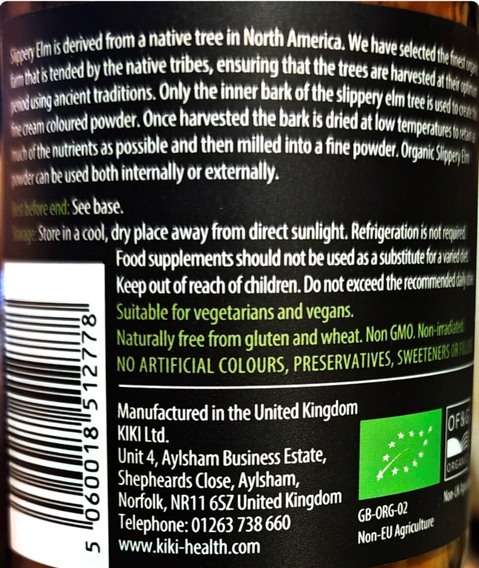 Close-up of the back of a KIKI Health product label showing product information, a barcode, ingredients text, and a green organic certification logo on a dark background.