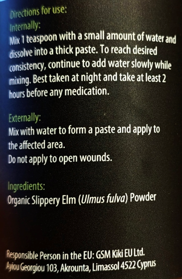 A close-up of a black product label showing white text with usage directions and ingredients for slippery elm powder.