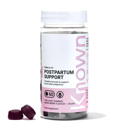 "Front view of Known Postpartum Support Gummies VEGAN, 60-count bottle with a couple of gummies around it."