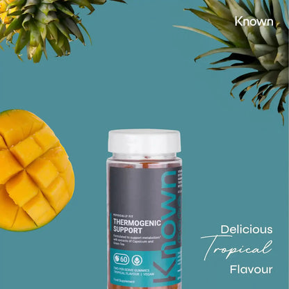  "Known Thermogenic Support Gummies VEGAN bottle surrounded by tropical fruits, emphasizing the delicious natural flavor."