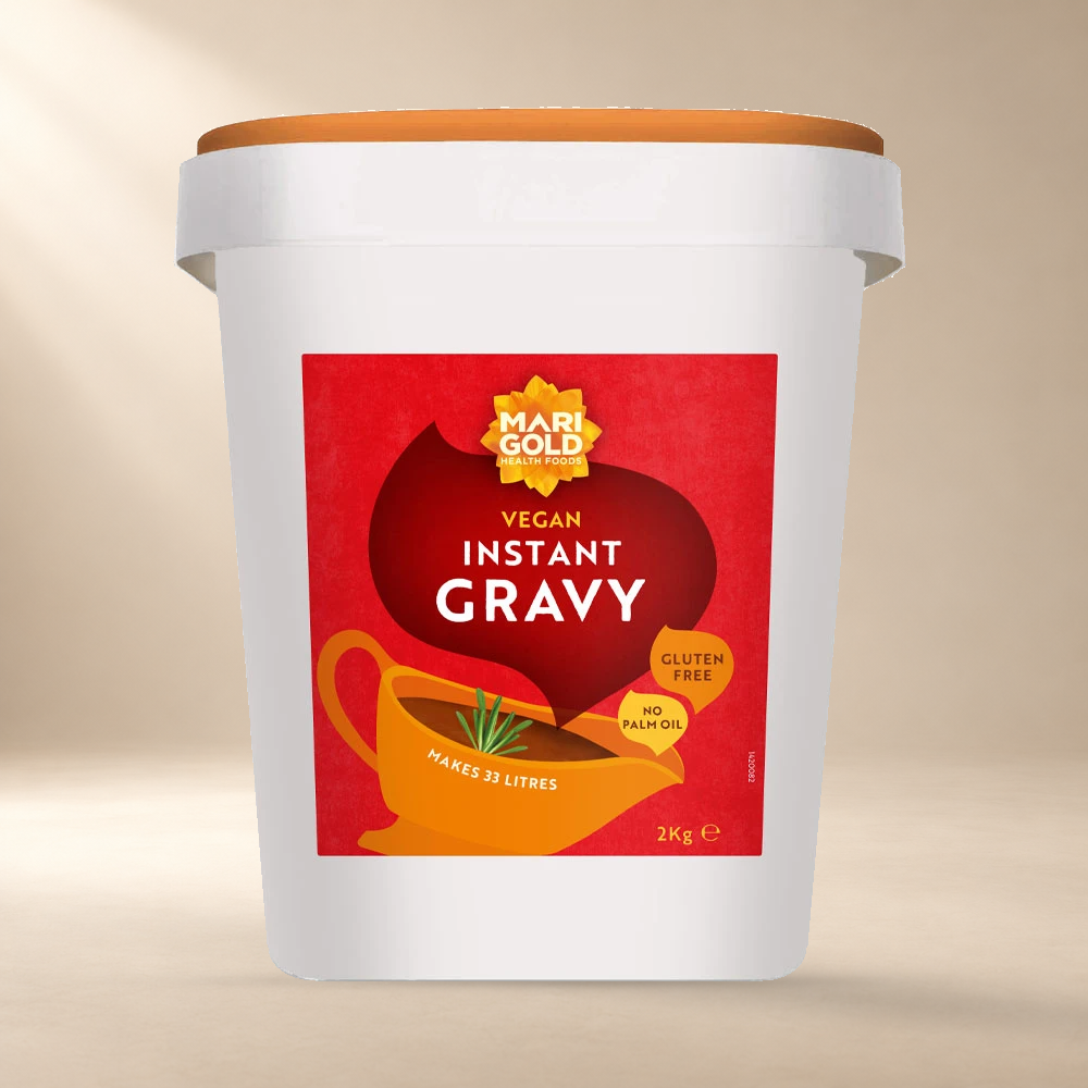 Marigold Instant Vegan Gravy – Gluten Free 2kg – front of authentic 2kg tub on warm cream background