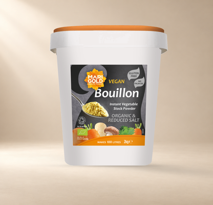 Marigold Organic Reduced Salt Vegan Vegetable Bouillon Powder – 2kg – front of authentic 2kg tub on warm cream background