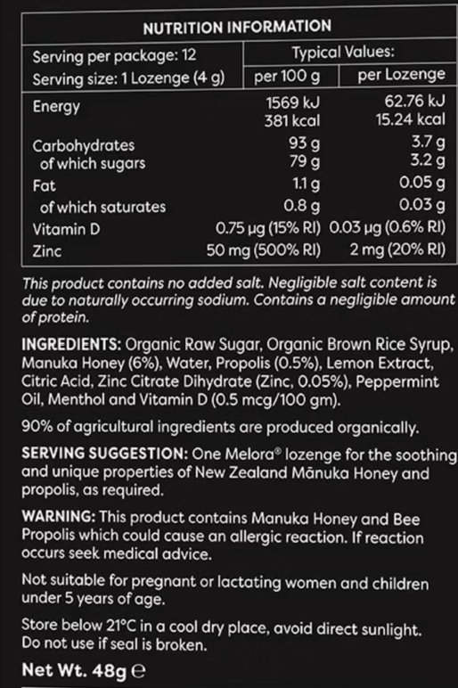 A close-up of a product's front nutrition information label showing serving size, typical values per 100 g and per Lozenge, ingredients, and storage instructions on a black background.