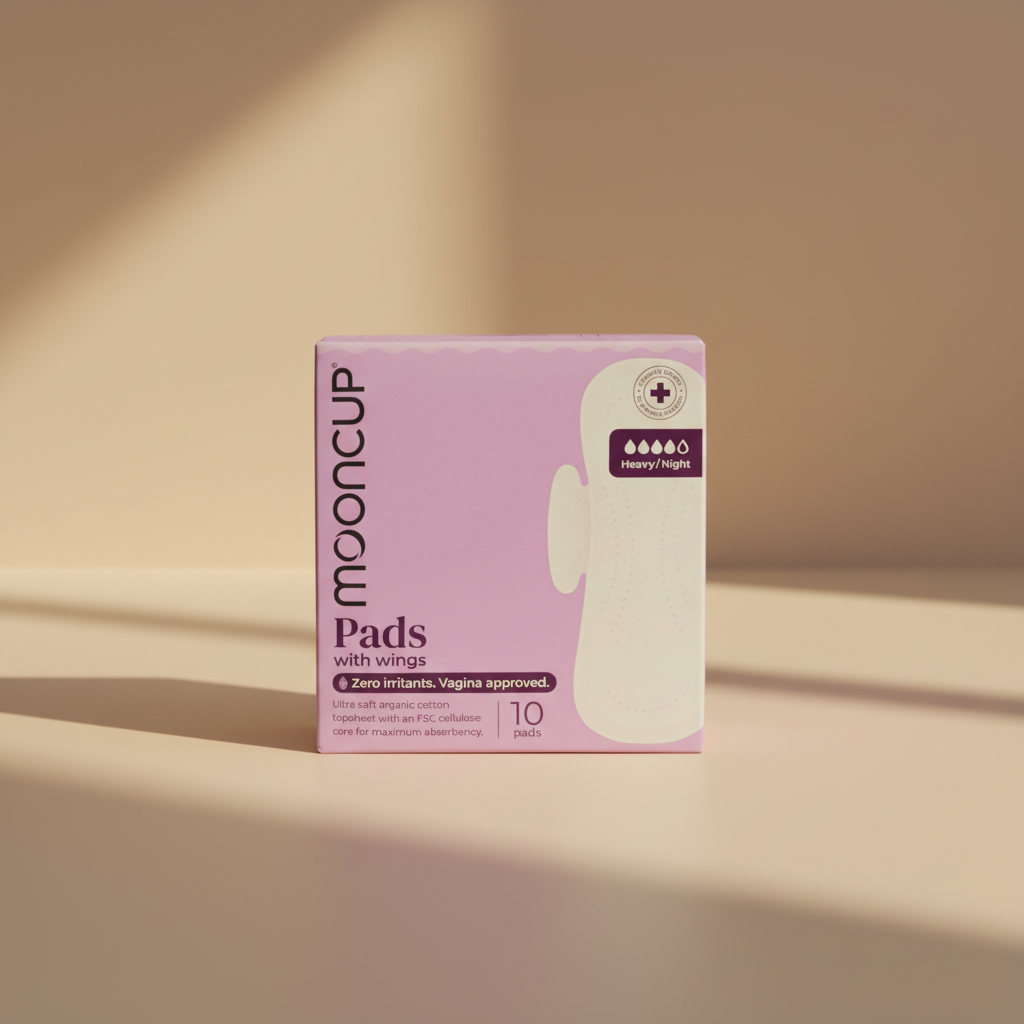 A box of Mooncup Pads with wings, size 10, featuring a light purple background and a graphic of a white sanitary pad with wings. The box highlights 'Zero irritants.