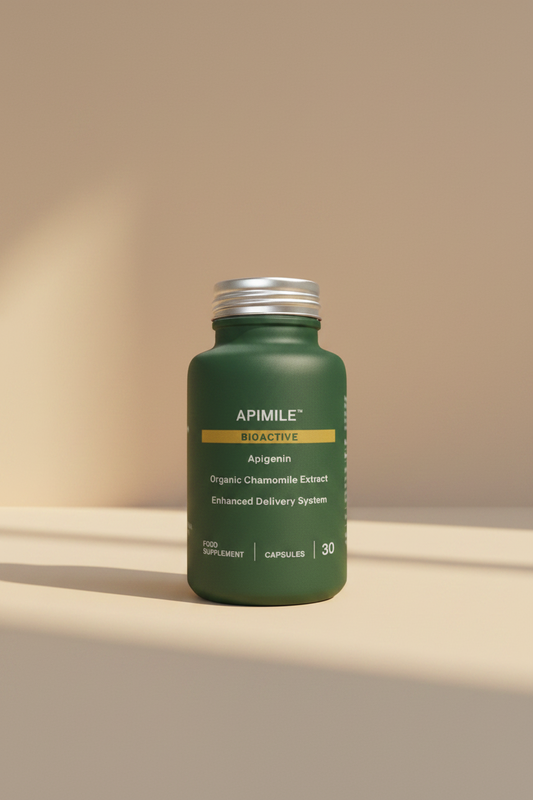 Green supplement bottle labeled 'Apimile Bioactive' on a beige background
