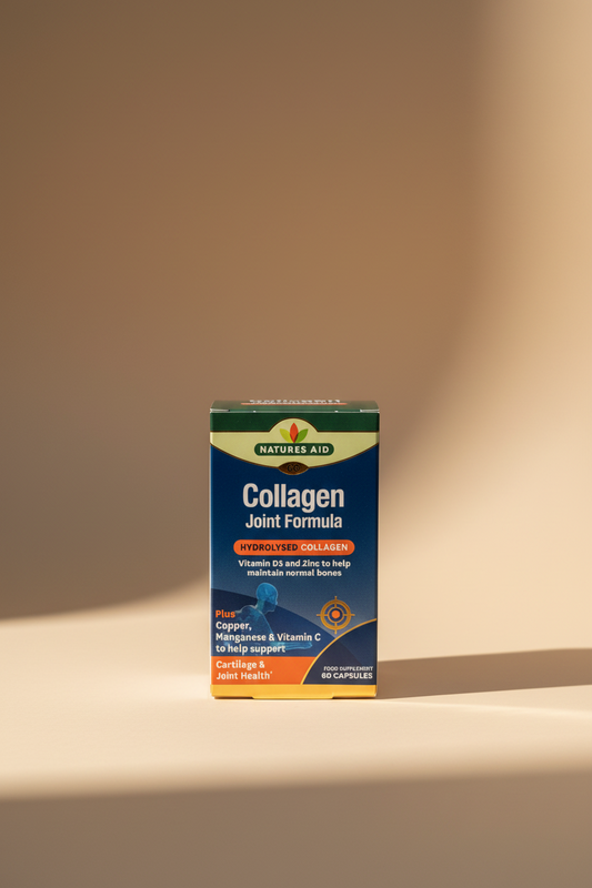 A box of Natures Aid Collagen Joint Formula supplement, shown standing on a wooden surface with a blurred indoor background.