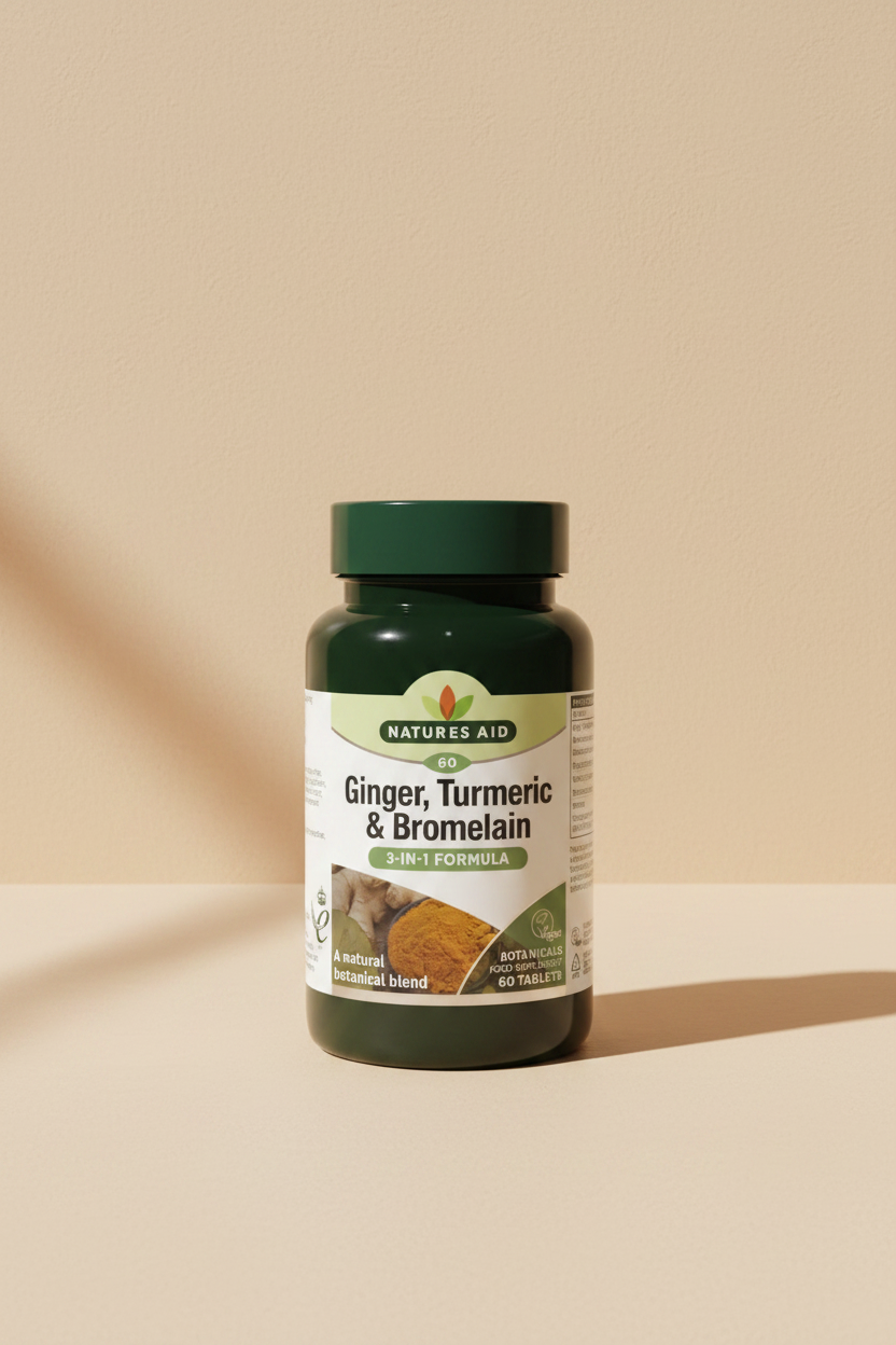 Natures Aid Ginger, Turmeric & Bromelain supplement bottle on a white background