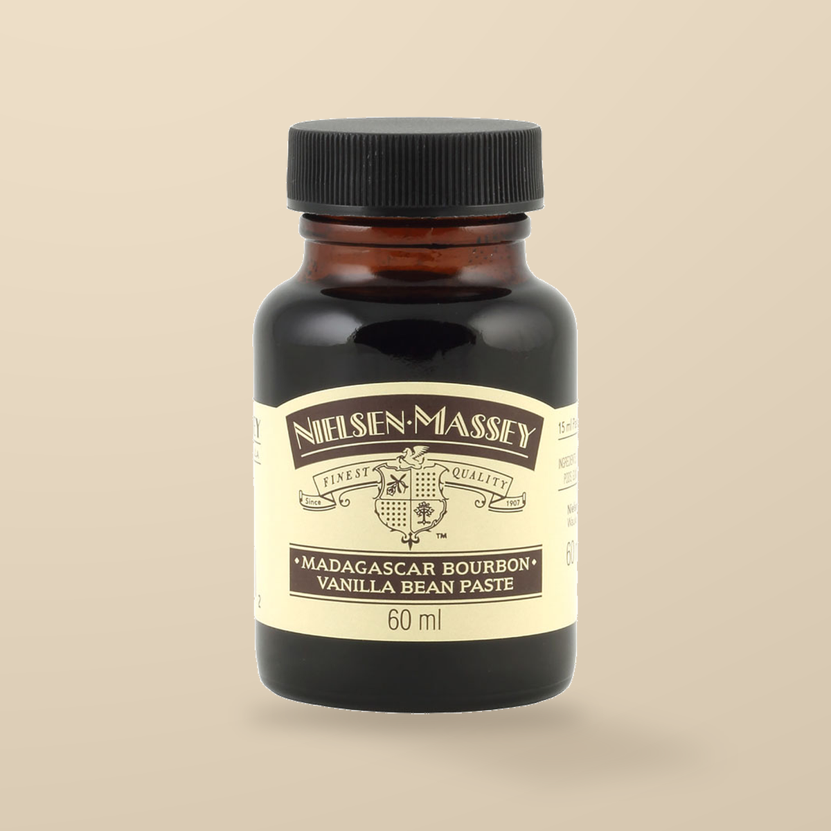 Nielsen-Massey Madagascar Bourbon Vanilla Bean Paste – 60ml — original product packaging on warm beige background