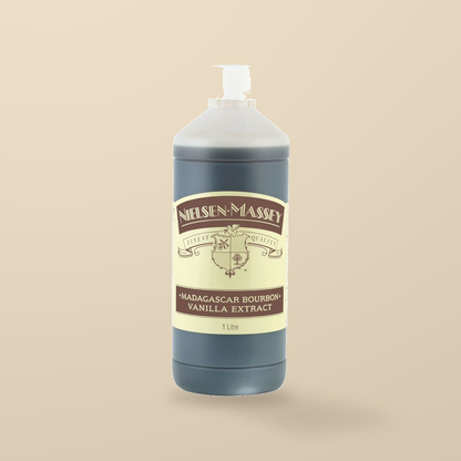 Nielsen-Massey Madagascar Bourbon Vanilla Extract – 1L — original product packaging on warm beige background