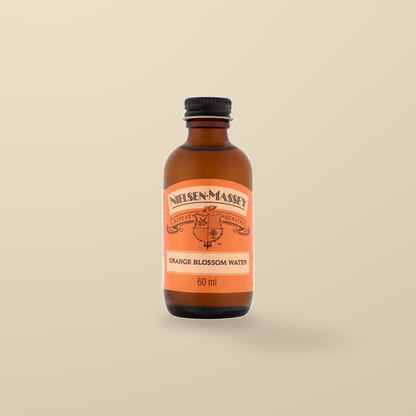 Nielsen-Massey Orange Blossom Water – 60ml — original product packaging on warm beige background