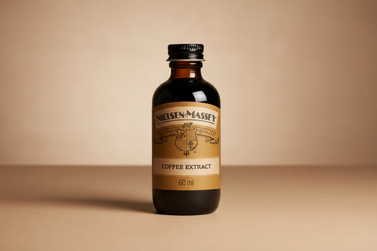 Bottle of Nielsen-Massey coffee extract on a white background