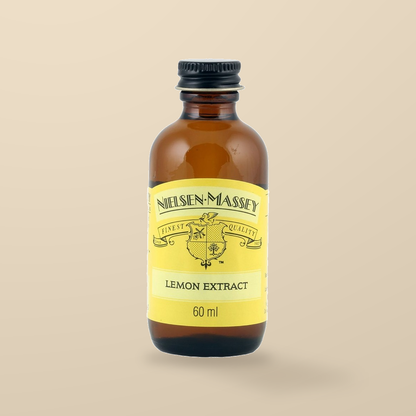 Nielsen-Massey Pure Lemon Extract – 60ml — original product packaging on warm beige background