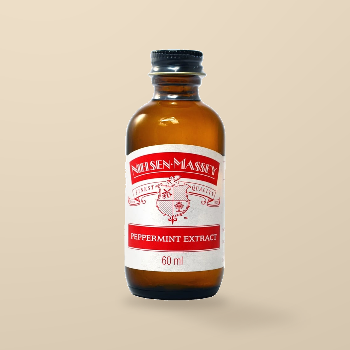 Nielsen-Massey Pure Peppermint Extract – 60ml — original product packaging on warm beige background