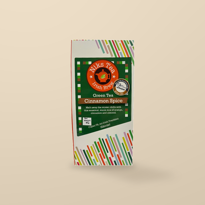 Niks Tea Cinnamon Spice Loose Leaf Green Tea – 80g — original product packaging on warm beige background