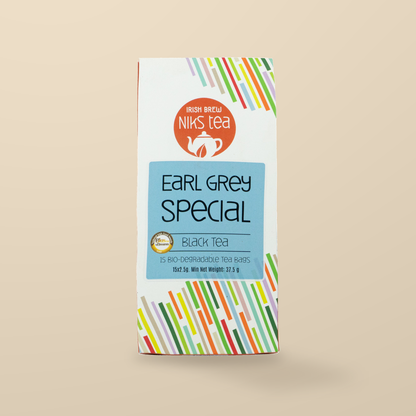 Niks Tea Earl Grey Special Black Tea with Cornflowers – 15 Tea Bags original product packaging on warm beige studio background