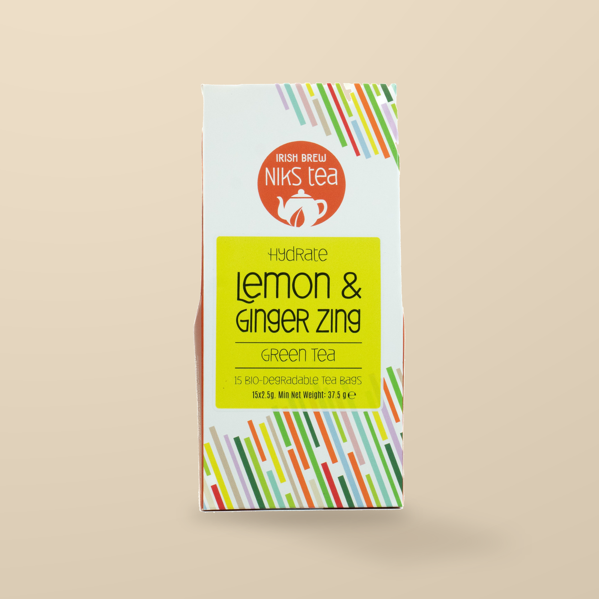 Niks Tea Lemon & Ginger Zing Green Tea – 15 Tea Bags original product packaging on warm beige studio background