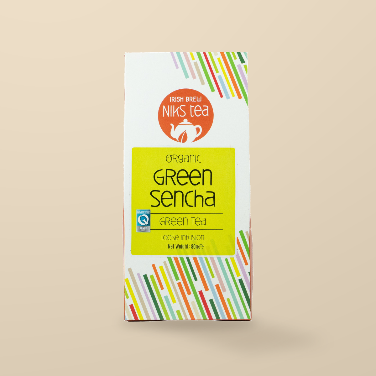 Niks Tea Organic Green Sencha Loose Tea – 80g original product packaging on warm beige studio background