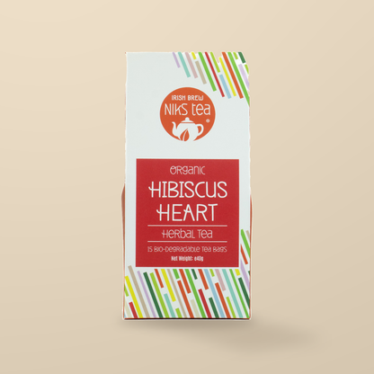 Niks Tea Organic Hibiscus Heart Herbal Tea – 15 Tea Bags original product packaging on warm beige studio background