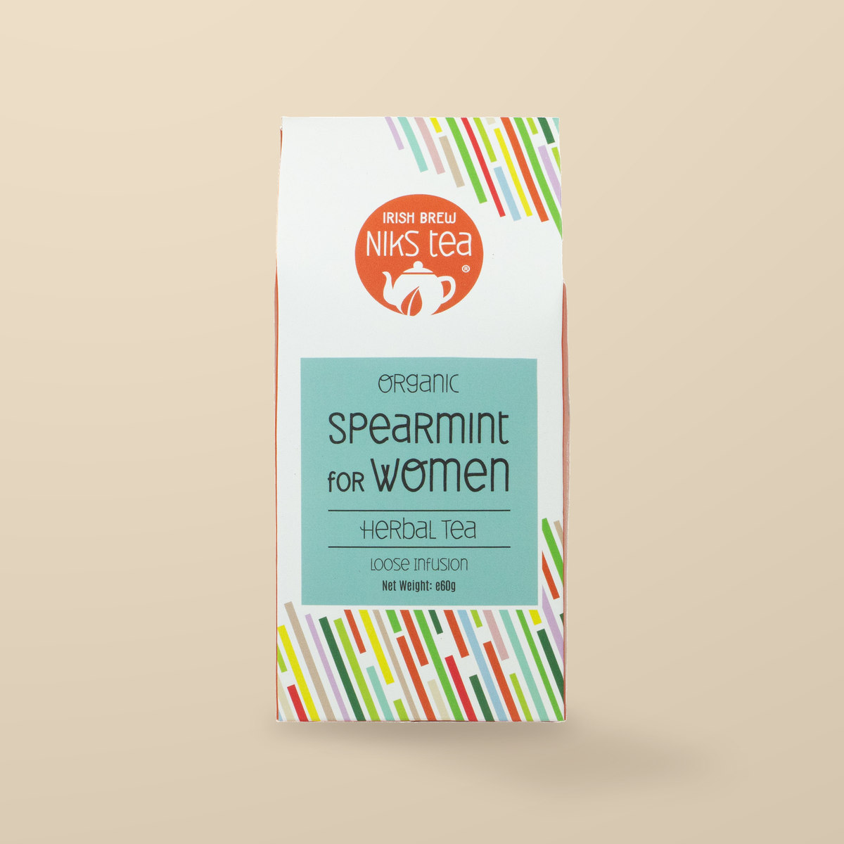 Niks Tea Organic Spearmint Herbal Loose Tea – 60g original product packaging on warm beige studio background