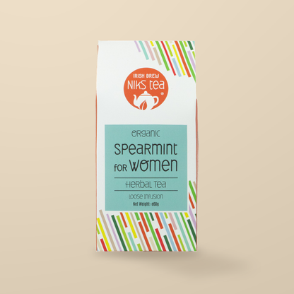 Niks Tea Organic Spearmint Herbal Loose Tea – 60g original product packaging on warm beige studio background