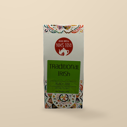 Niks Tea Traditional Irish Assam Black Loose Tea – 80g original product packaging on warm beige studio background