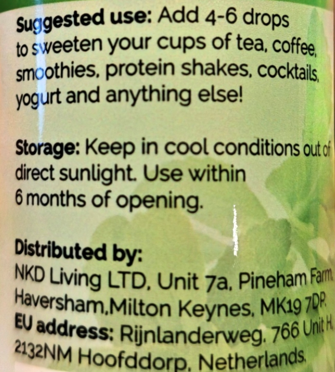 Close-up of a product label with black text on a pale green background. Visible text includes suggested use, storage instructions, and distributor information for NKD Living LTD.