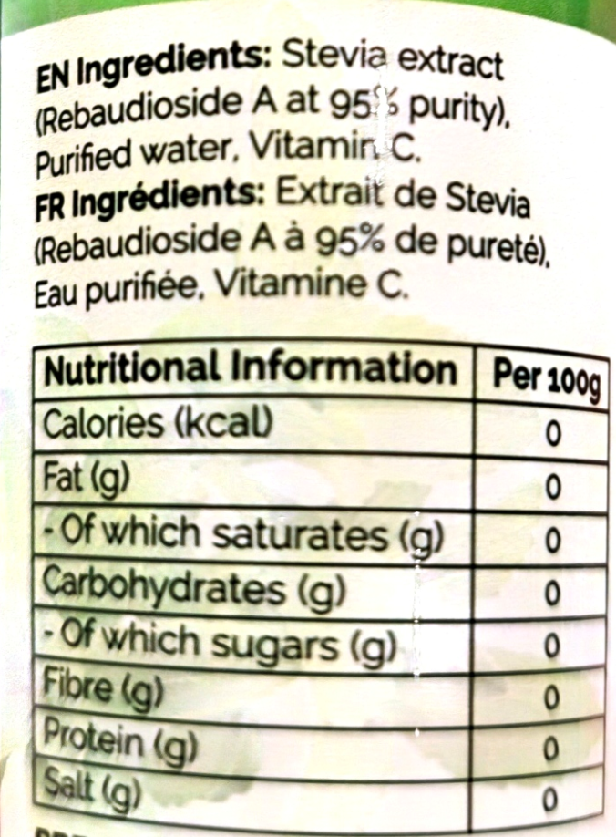 Close-up of a product label showing the ingredients list in English and French, with a nutritional information table below. The label is mostly white with black text and a faint green area at the top edge.