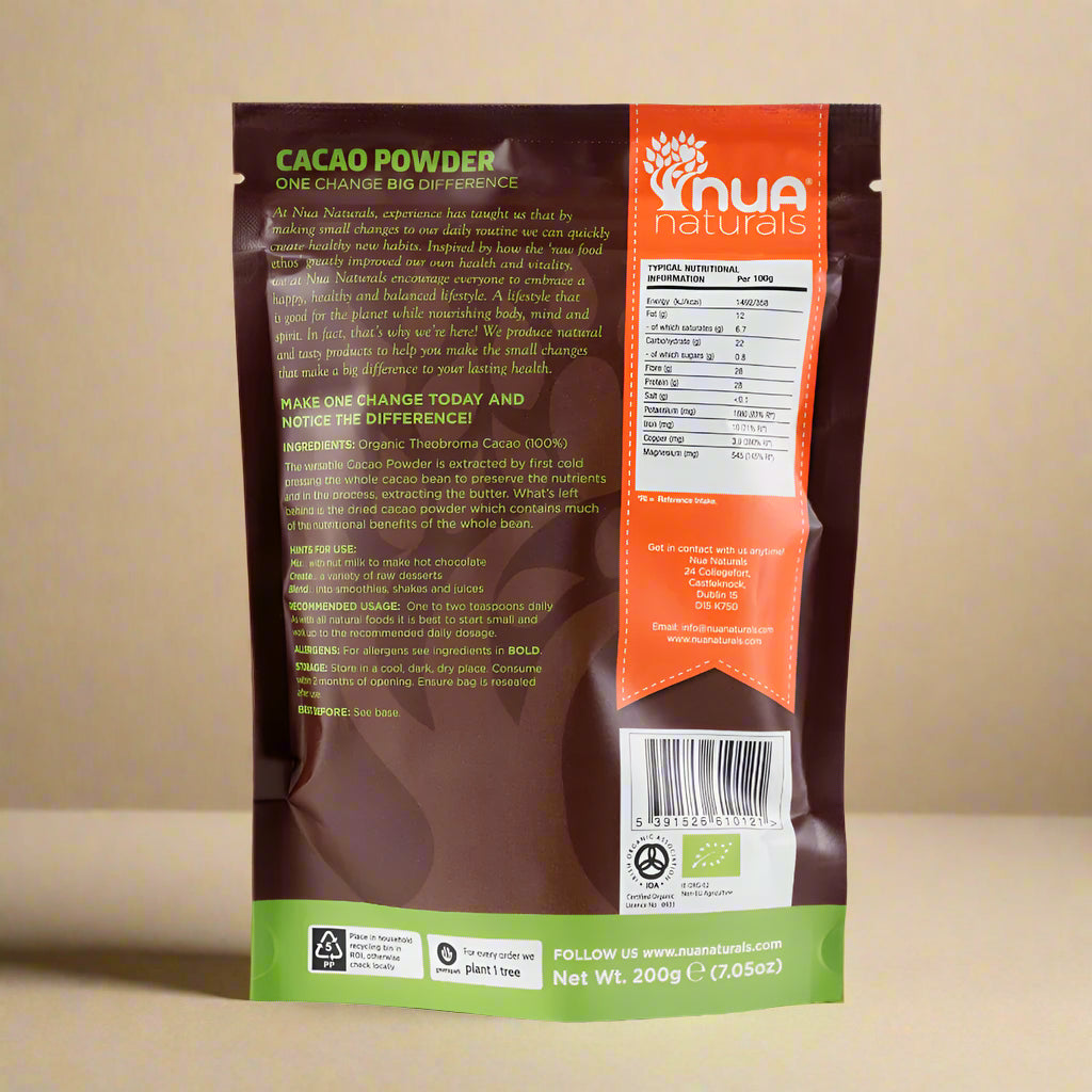 Organic cacao powder in a wooden bowl on a kitchen counter