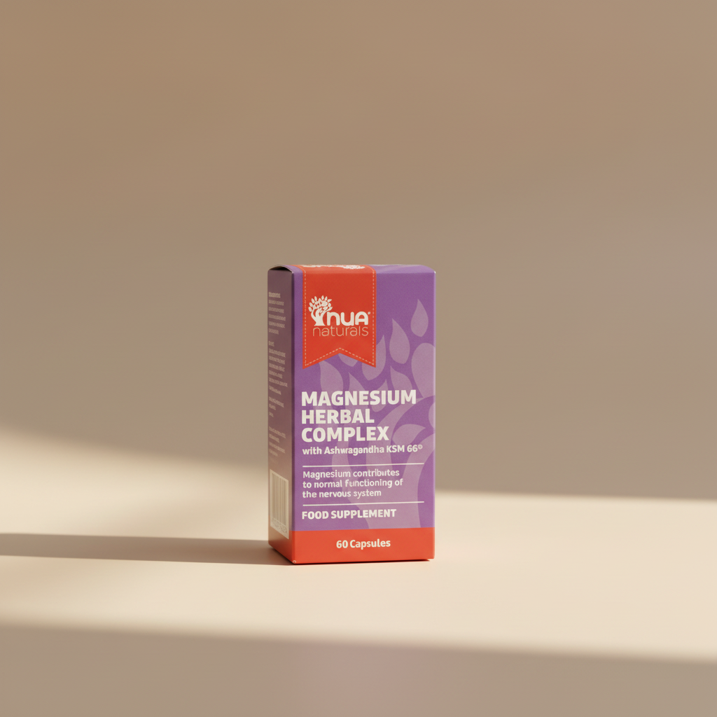 A box of Nua Naturals Magnesium Herbal Complex food supplement, featuring a purple and red design with white text, photographed on a wooden surface.