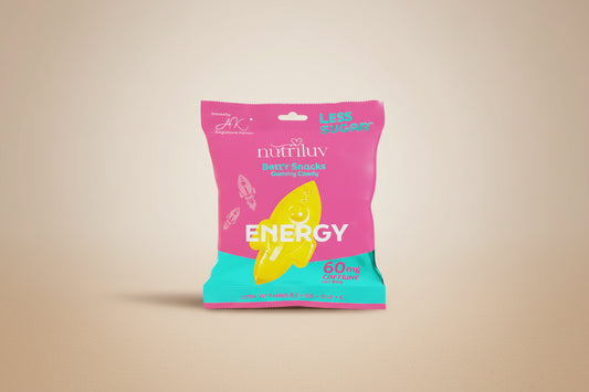 Pink and teal package of NutriLuv energy snacks with a yellow candy on a white background