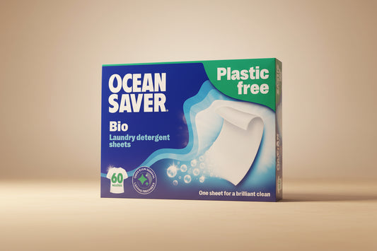 Box of Ocean Saver laundry detergent sheets on a blue background
