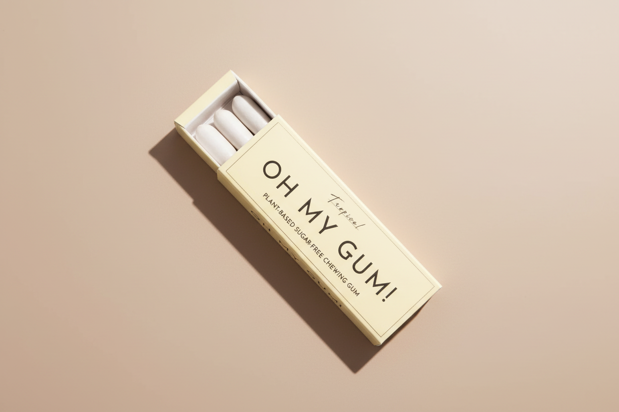 Box of 'Oh My Gum!' plant-based sugar-free chewing gum on a pink background