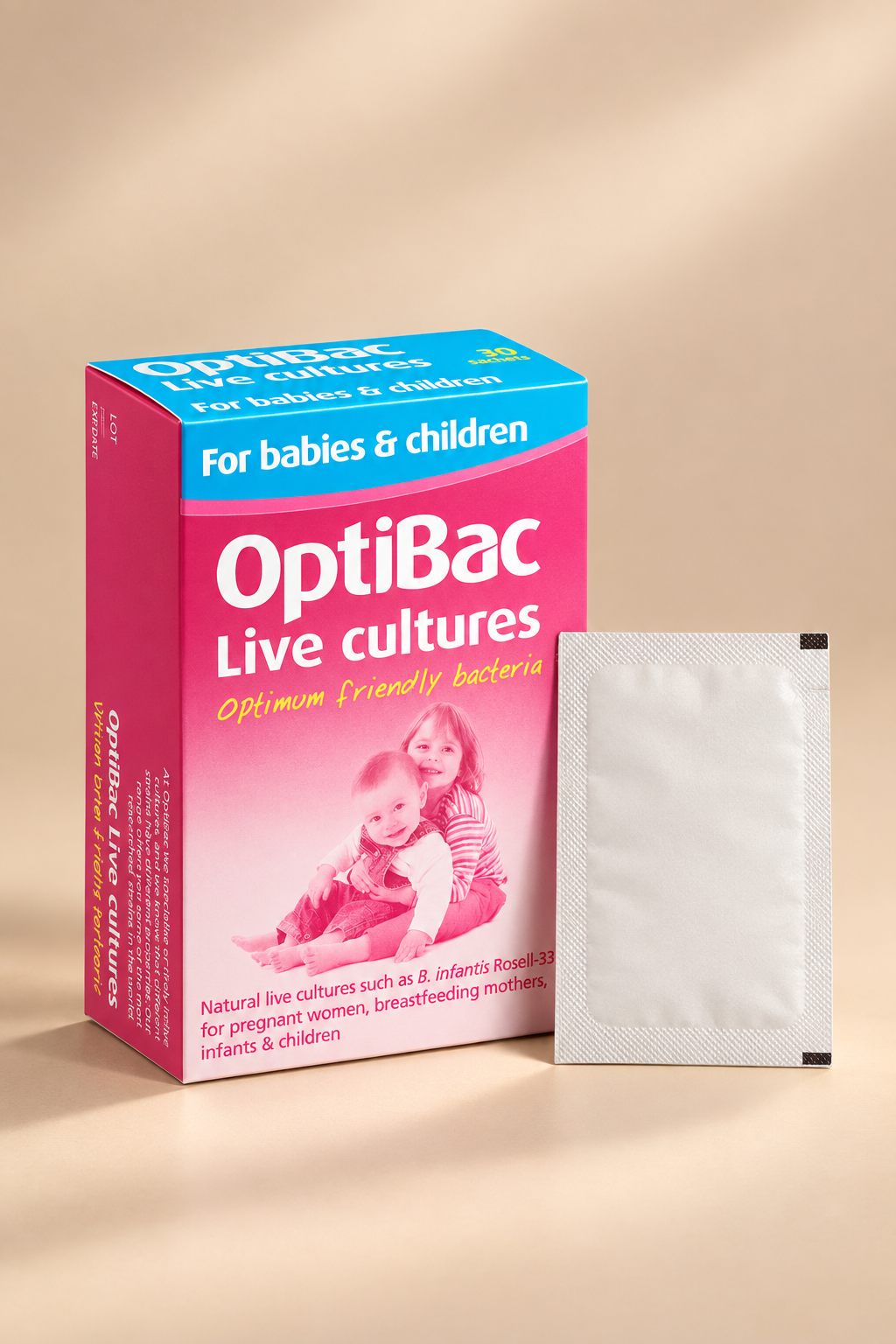 Packaging of Optibac Live Cultures for babies and children, showing a box and a sachet, with pink and blue colors and illustrations of babies and a breast-feeding mother.