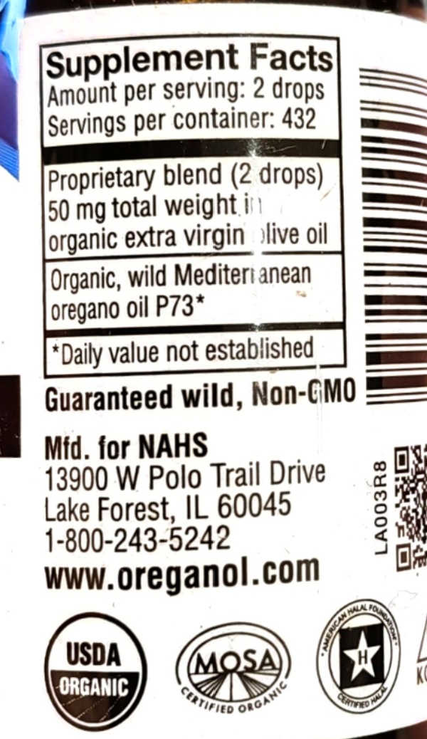 Close-up of a supplement facts label on a white bottle, showing text about 2 drops of a proprietary blend in organic extra virgin olive oil, with a barcode, NAHS contact information, and USDA Organic and MOSA certification logos at the bottom.