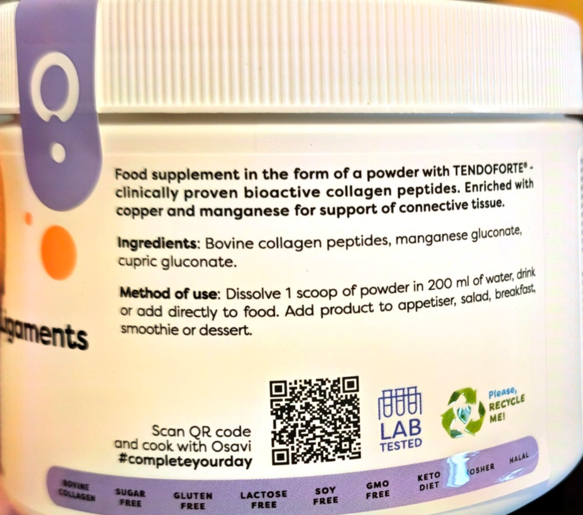 Close-up of a white supplement jar label showing product details, ingredients, usage instructions, a QR code, a blue-and-white LAB TESTED seal, and a purple circular logo on a white background.