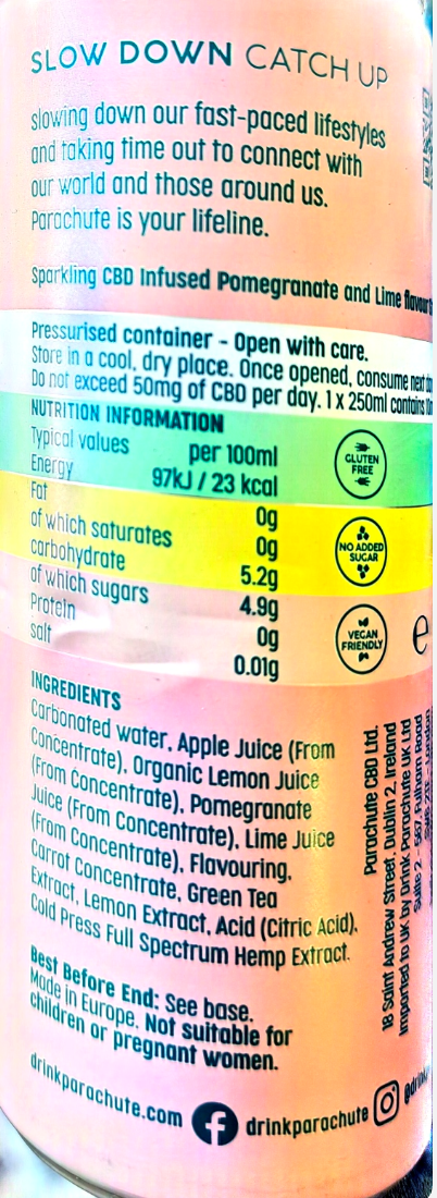 Close-up of a colorful beverage can label with text reading 'SLOW DOWN CATCH UP' and 'sparkling CBD infused Pomegranate and Lime juice' by drinkparachute.com.