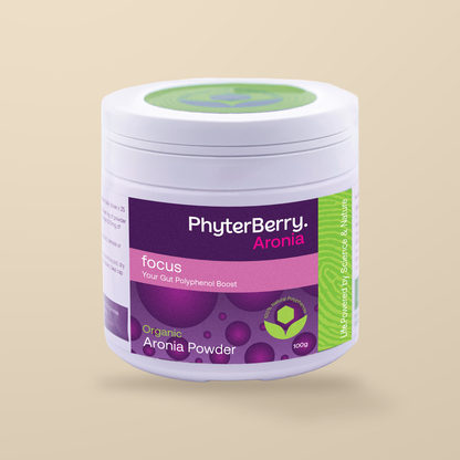 PhyterBerry Focus Organic Aronia Powder 100g — original product packaging on warm beige background