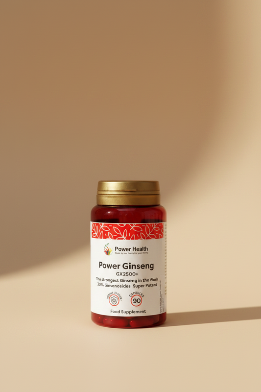 A bottle of Power Health Power Ginseng GX2500+ food supplement with a red body, gold cap, and white label, resting on a wooden surface.