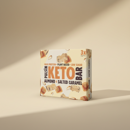 Box of Pulsin' Keto Bar Almond & Salted Caramel on a beige background