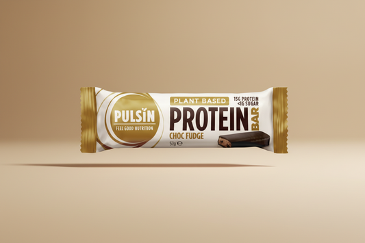 Pulsin' protein bar packaging with 'Choc Fudge' flavor on a white background