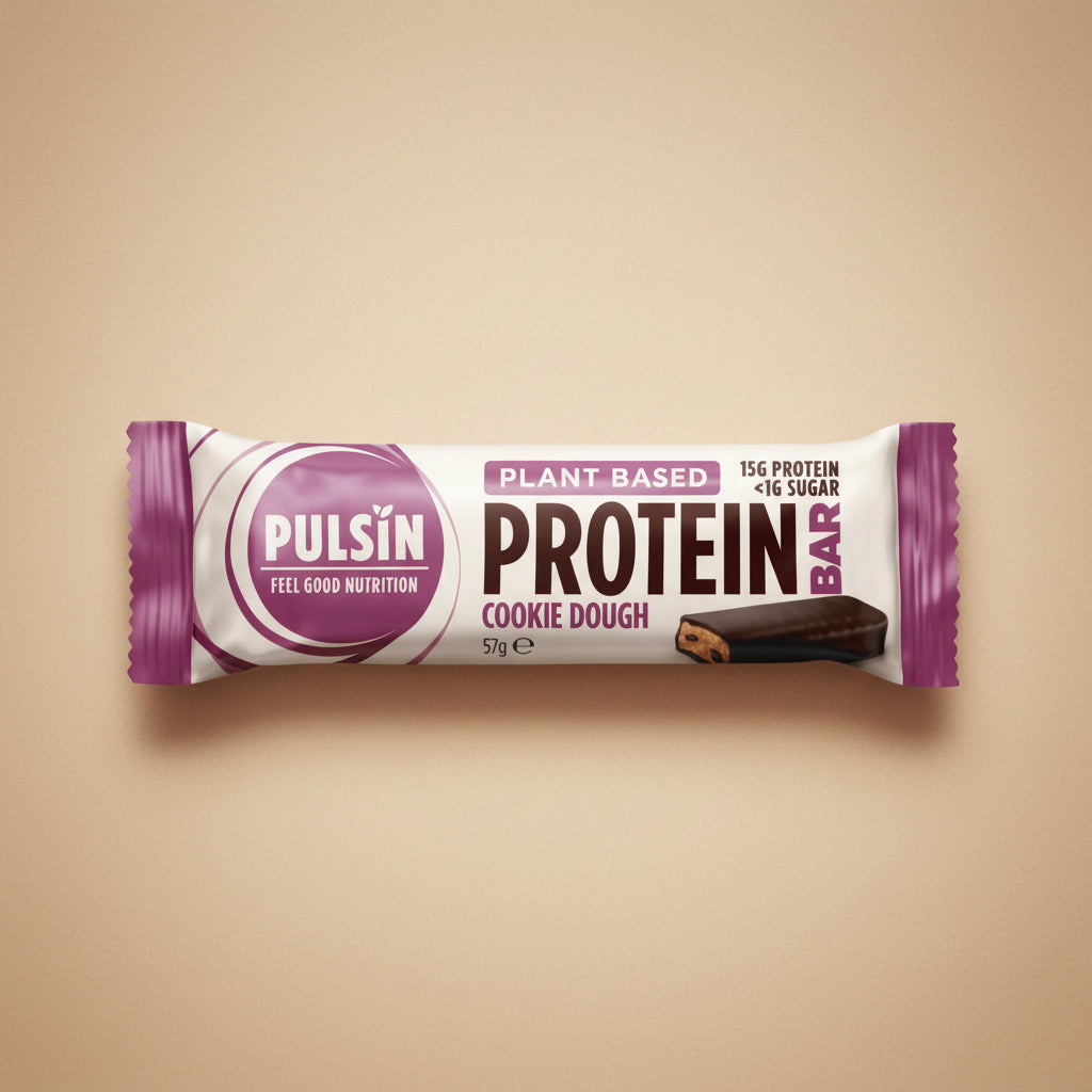 Pulsin' plant-based protein bar packaging on a white background with decorative elements.