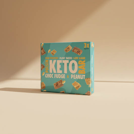 Box of Pulsin' Keto Choc Fudge & Peanut bars on a light blue background