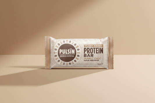 Pulsin' plant-based protein bar packaging on a white background