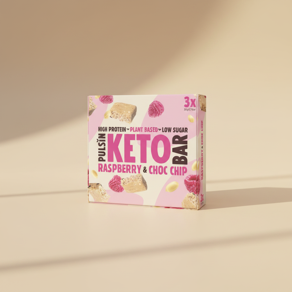 Pulsin' keto bar packaging with raspberry and chocolate chip flavor on a light background