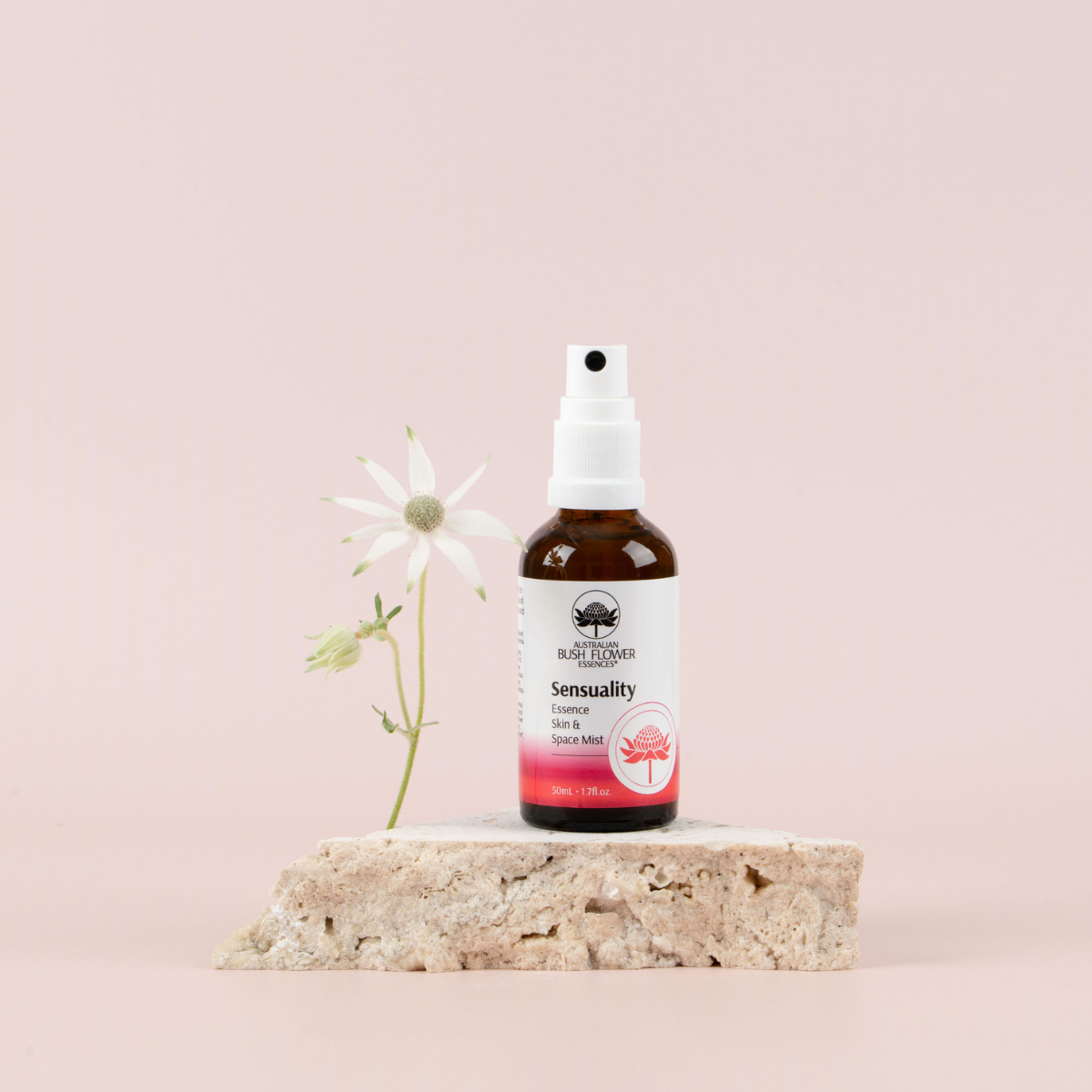 Australian Bush Flower Sensuality Organic Space Mist 50ml on a stone display with a flower