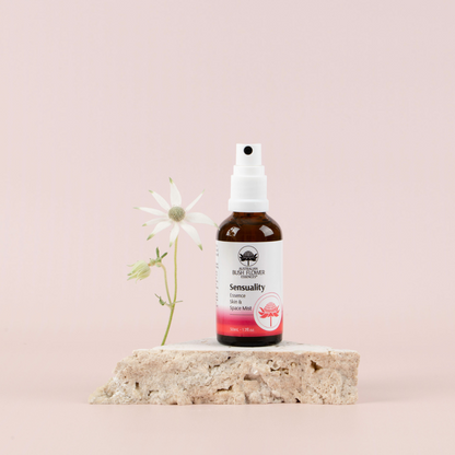Australian Bush Flower Sensuality Organic Space Mist 50ml on a stone display with a flower